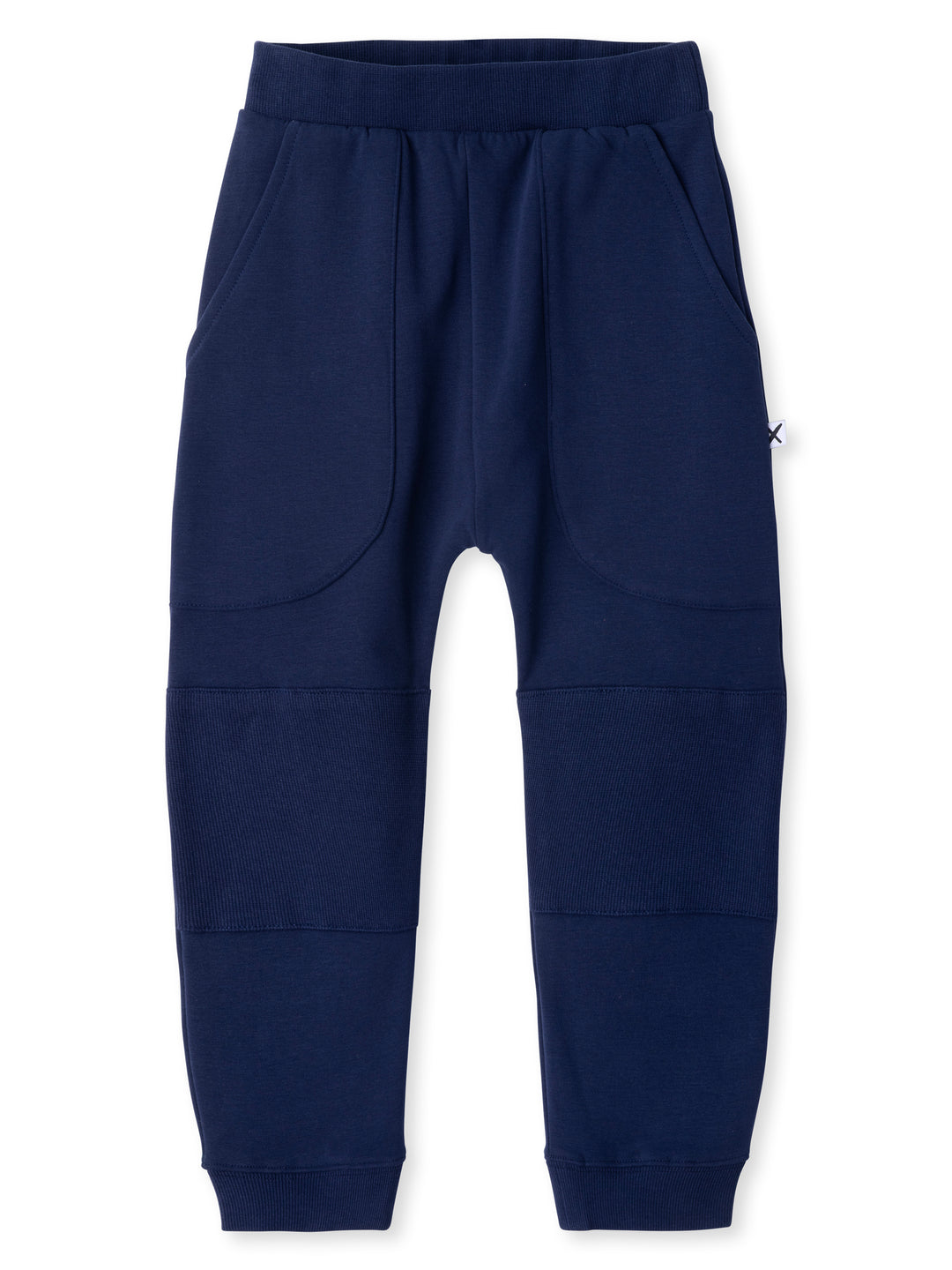 Minti kids clothing. Super cool baggy trackies featuring elastic waistband, front pockets, back pocket, 2x2 rib cuffs and reinforced 2x2 rib knee patches. Minti embroidery on the back pocket. 330 Gram // Brushed Inside // 95% Cotton // 5% Elastane.