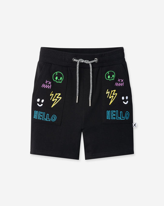 Badges Short in black, boys shorts by Minti, flat lay
