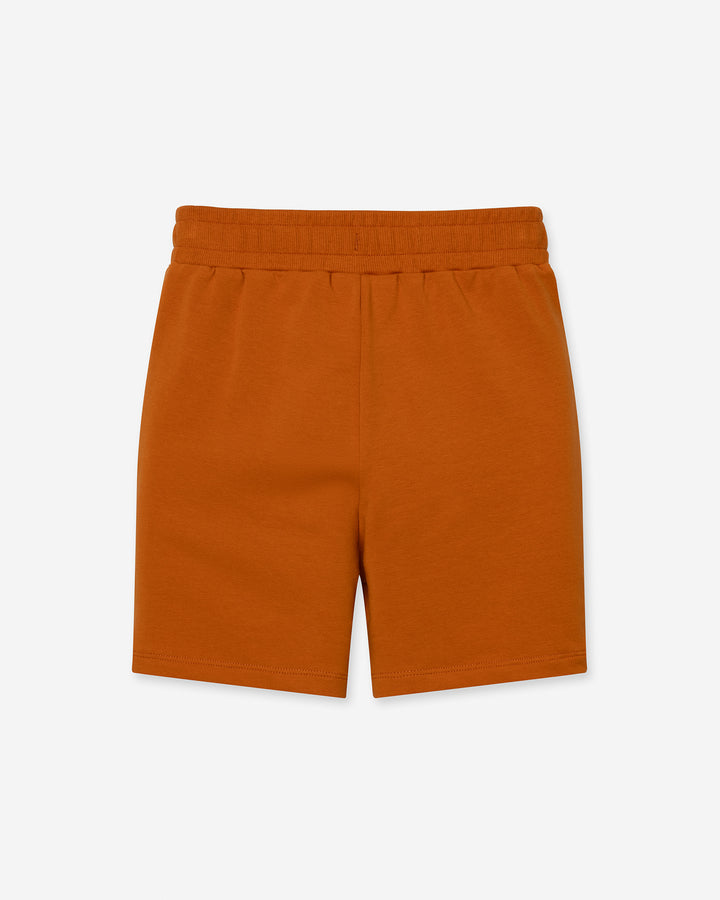 Track Short in burnt orange, boys shorts by Minti, flat lay, back view