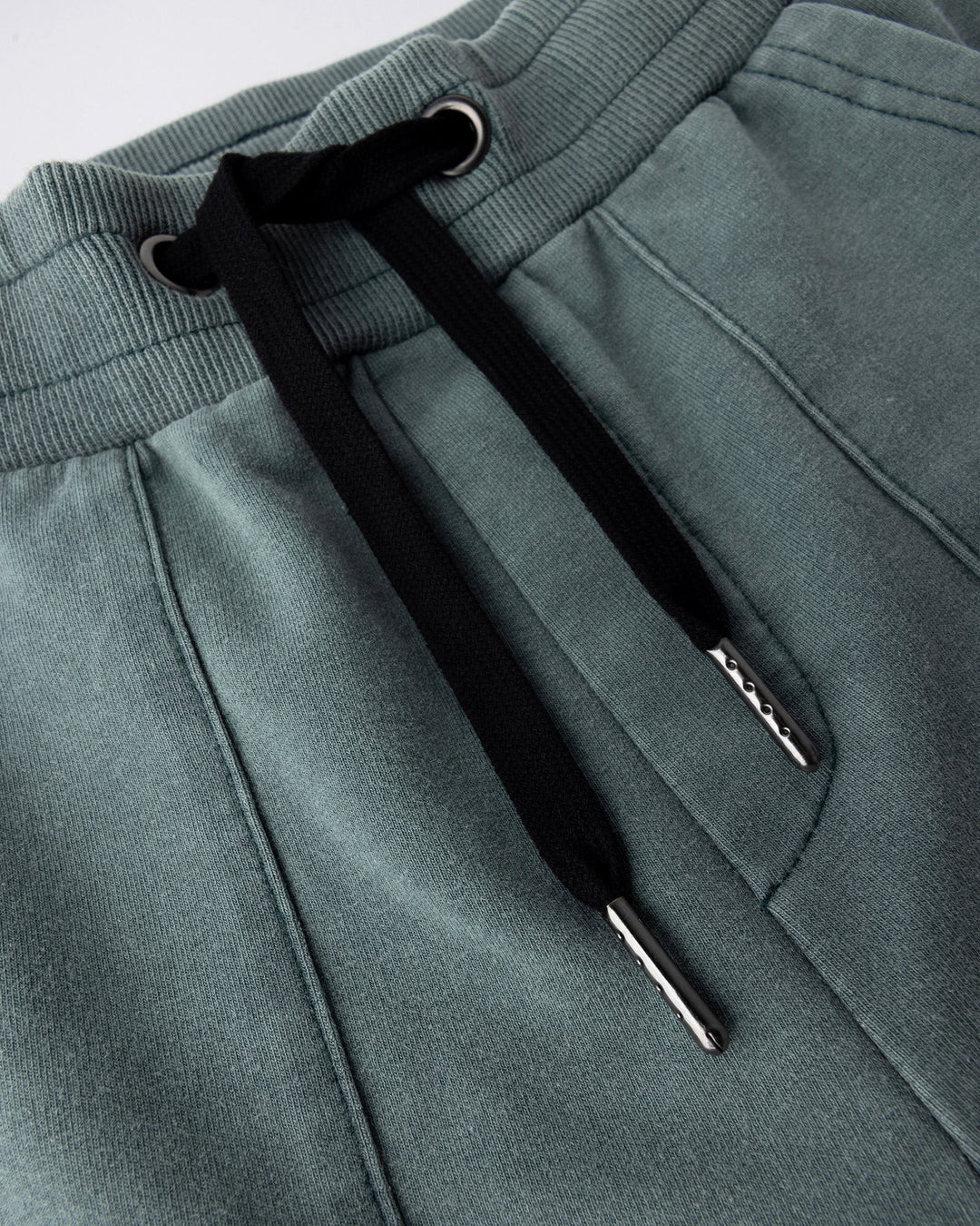 Close up detail of the Blasted Track Short in forest wash