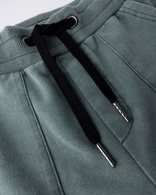 Close up detail of the Blasted Track Short in forest wash