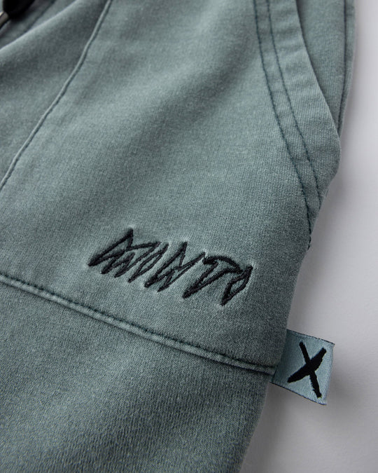 Close up detail of the Blasted Track Short in forest wash