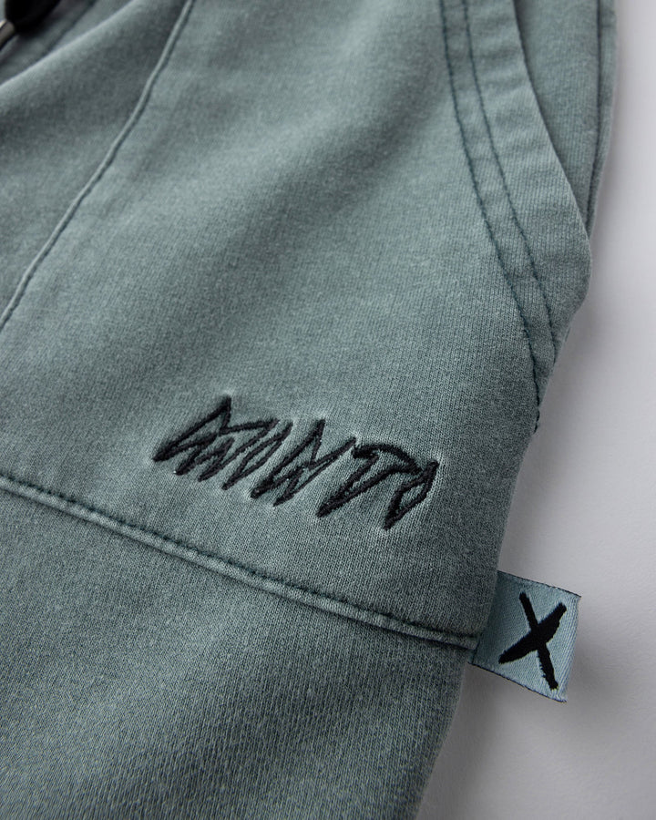Close up detail of the Blasted Track Short in forest wash