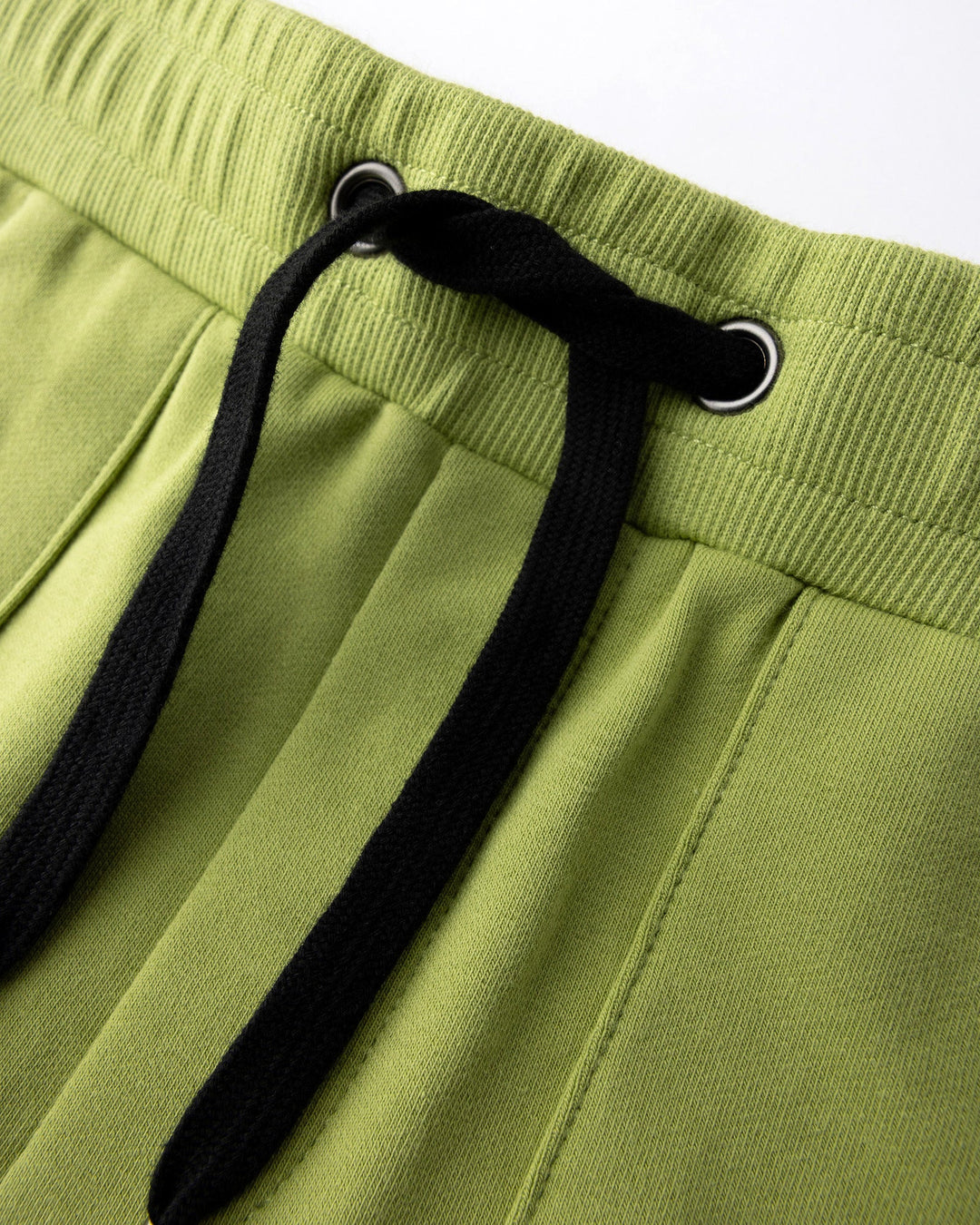 Close up detail of the Track Short in lime