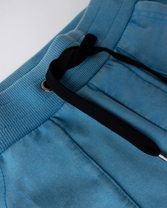 Close up detail of the Blasted Track Short in sky wash