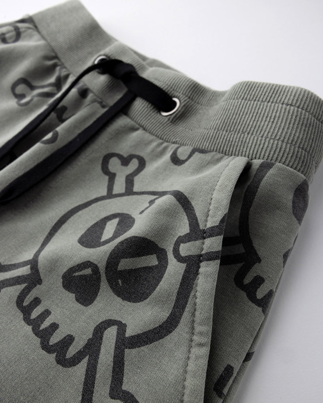 Close up detail of the Hello Skull Short in grey wash