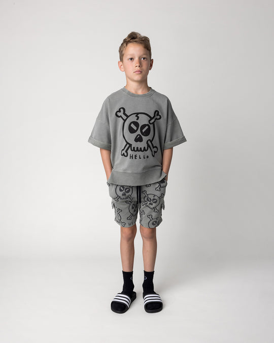 Kid wearing the Hello Skull Short in grey wash with the Hello Skull Short Sleeve Crew in grey wash, front view