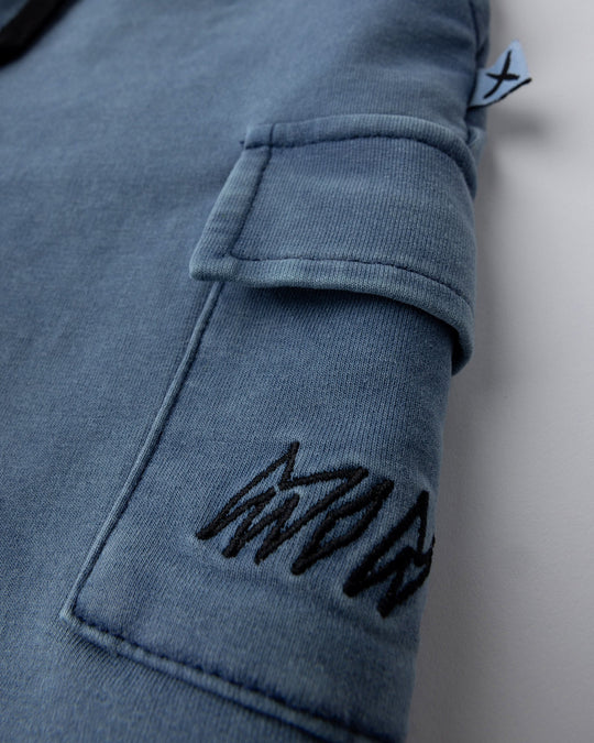 Close up detail of the Blasted Deluxe Cargo Short in midnight wash