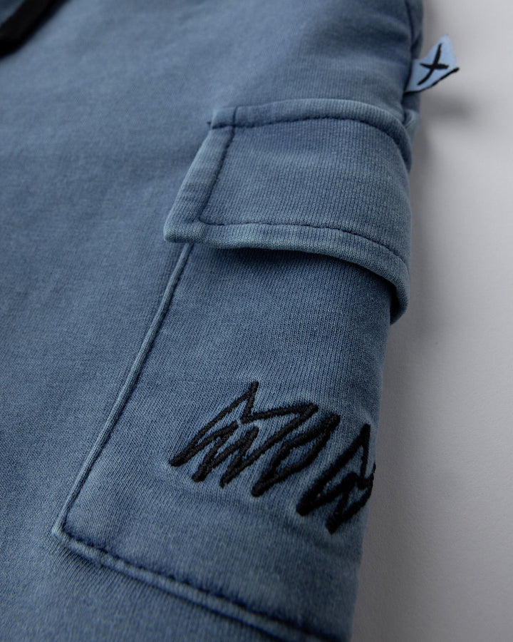 Close up detail of the Blasted Deluxe Cargo Short in midnight wash