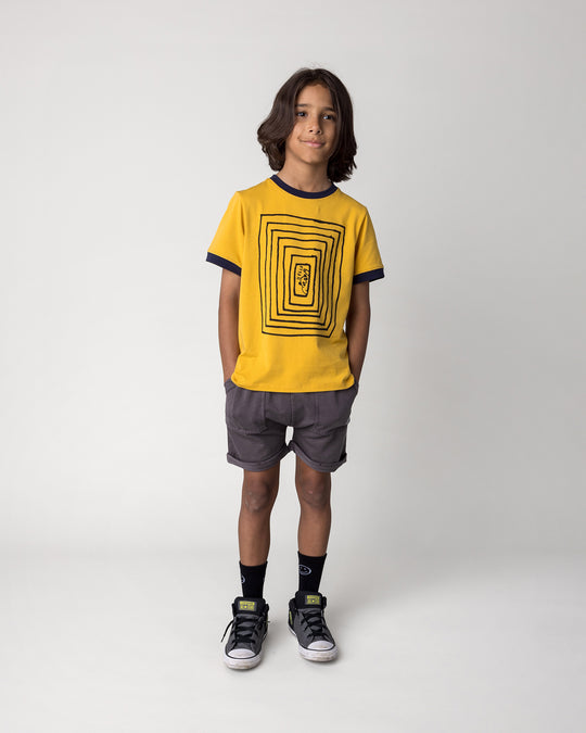 Kid wearing the Blasted Roller Short in black wash with the Hidden Panda Tee in mustard and ink, front view