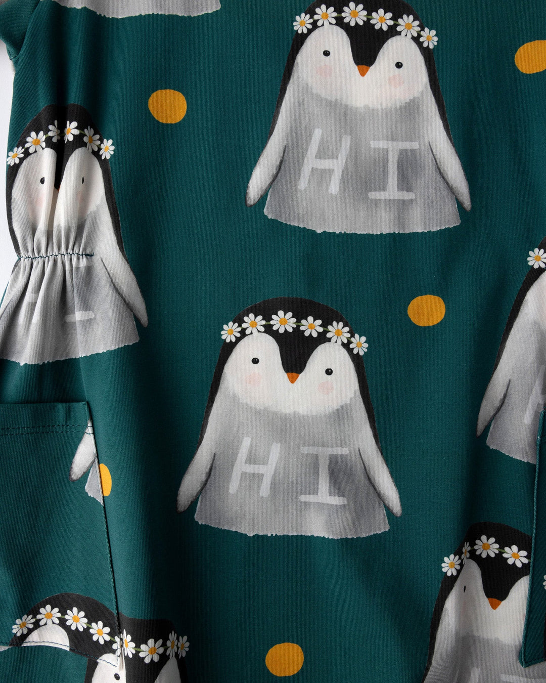 Close up of the Flower Penguin Dress print in dark green