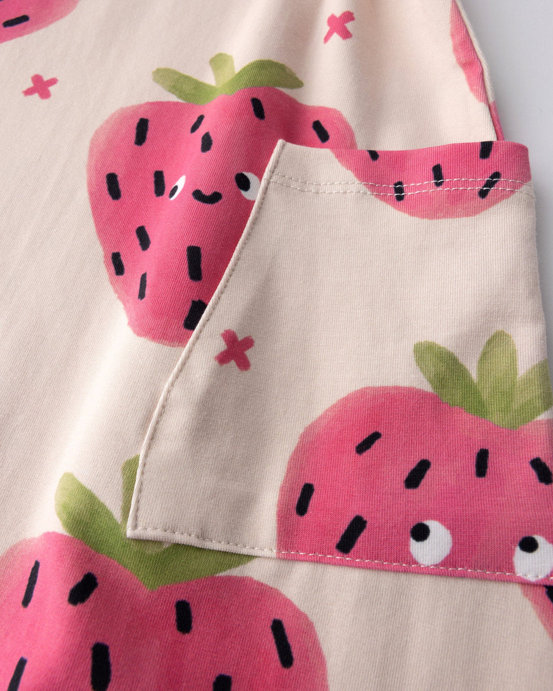 Close up detail of the Happy Strawberry Dress in cream