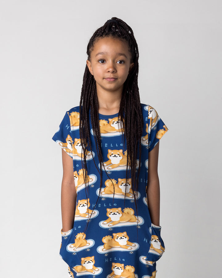 Close up of the Skate Puppy Dress in midnight on a kid, front view