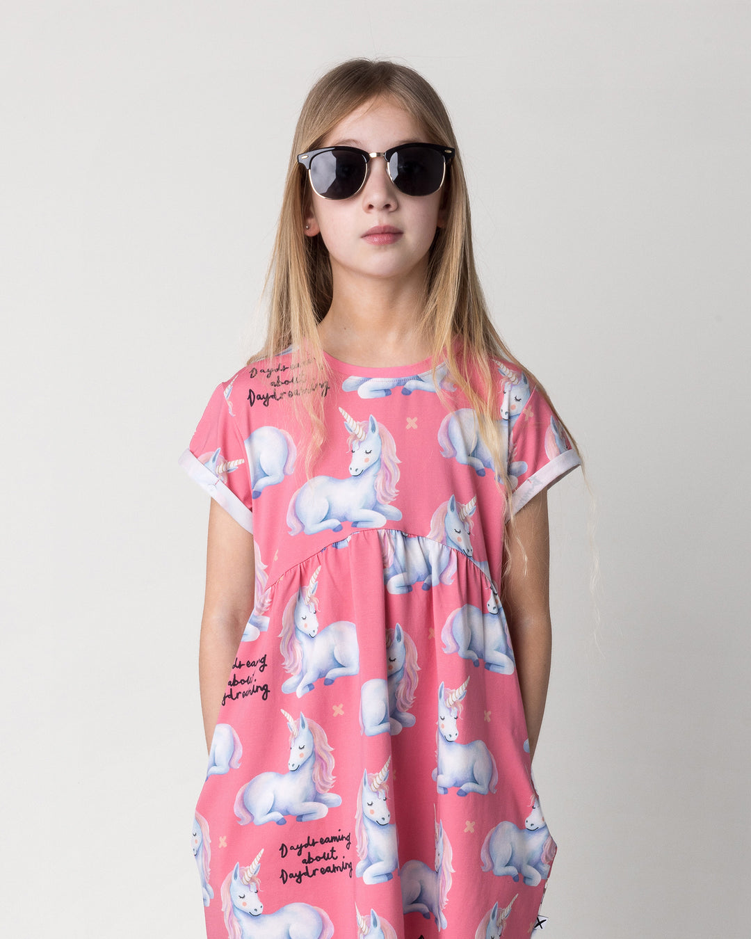 Close up of the Daydreaming Unicorn Dress in candy on a kid, front view