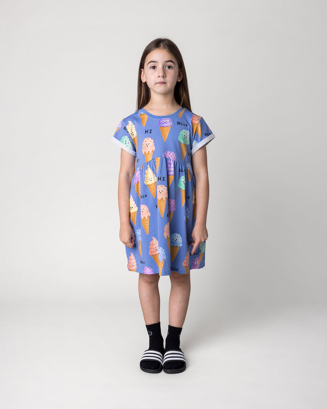 Kid wearing the Happy Icecreams Dress in cornflower, front view