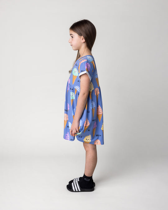 Kid wearing the Happy Icecreams Dress in cornflower, side view