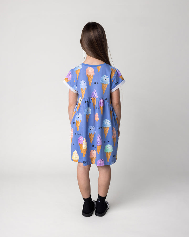 Kid wearing the Happy Icecreams Dress in cornflower, back view