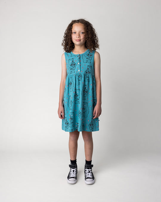 Kid wearing the Bear Hug Dress in emerald, front view