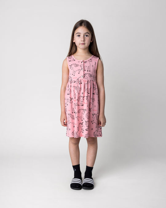 Kid wearing the Hello Unicorns Dress in pink, front view