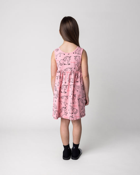 Kid wearing the Hello Unicorns Dress in pink, back view