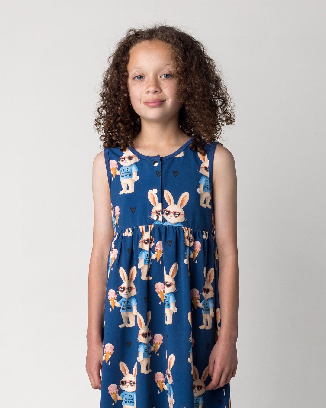 Close up of the Icecream Bunny Dress in blue on a kid, front view