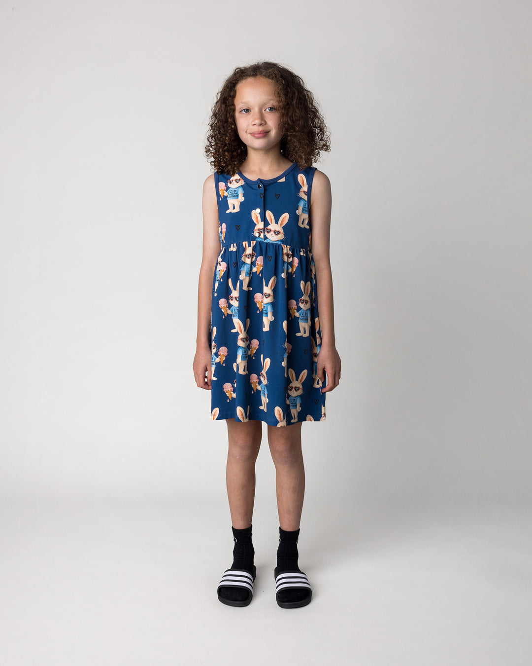 Kid wearing the Icecream Bunny Dress in blue, front view