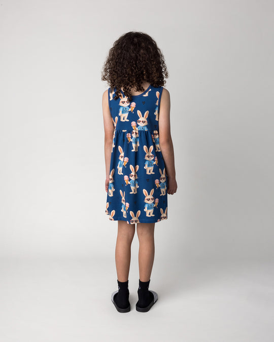 Kid wearing the Icecream Bunny Dress in blue, back view
