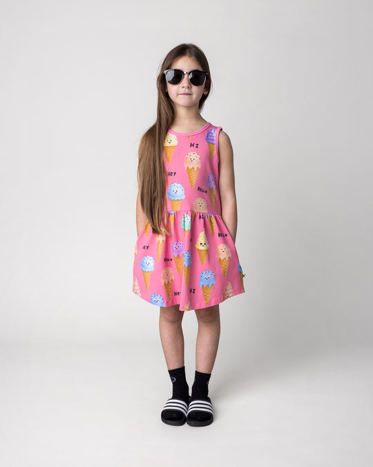 Kid wearing the Happy Icecreams Dress in pink, front view