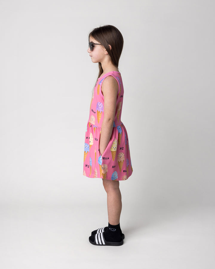 Kid wearing the Happy Icecreams Dress in pink, side view