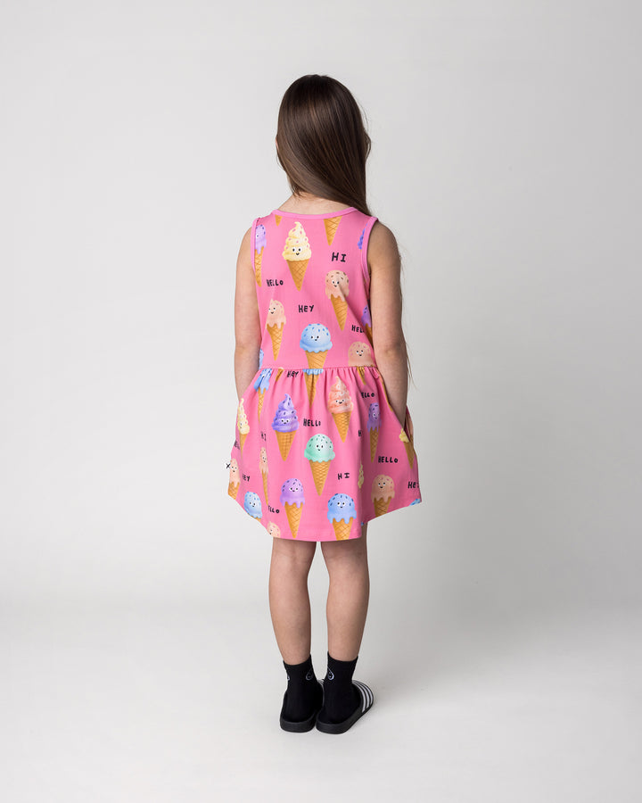 Kid wearing the Happy Icecreams Dress in pink, back view