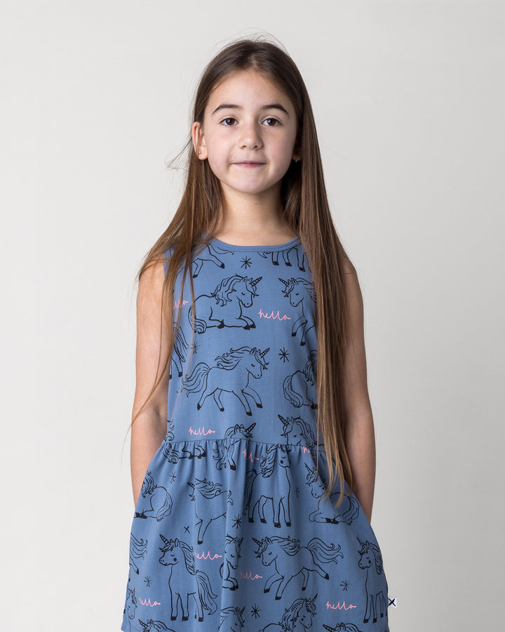 Close up of the Hello Unicorns Dress in mid blue on a kid, front view
