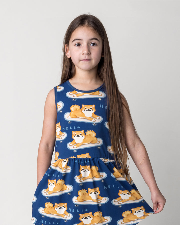 Close up of the Skate Puppy Dress in midnight on a kid, front view