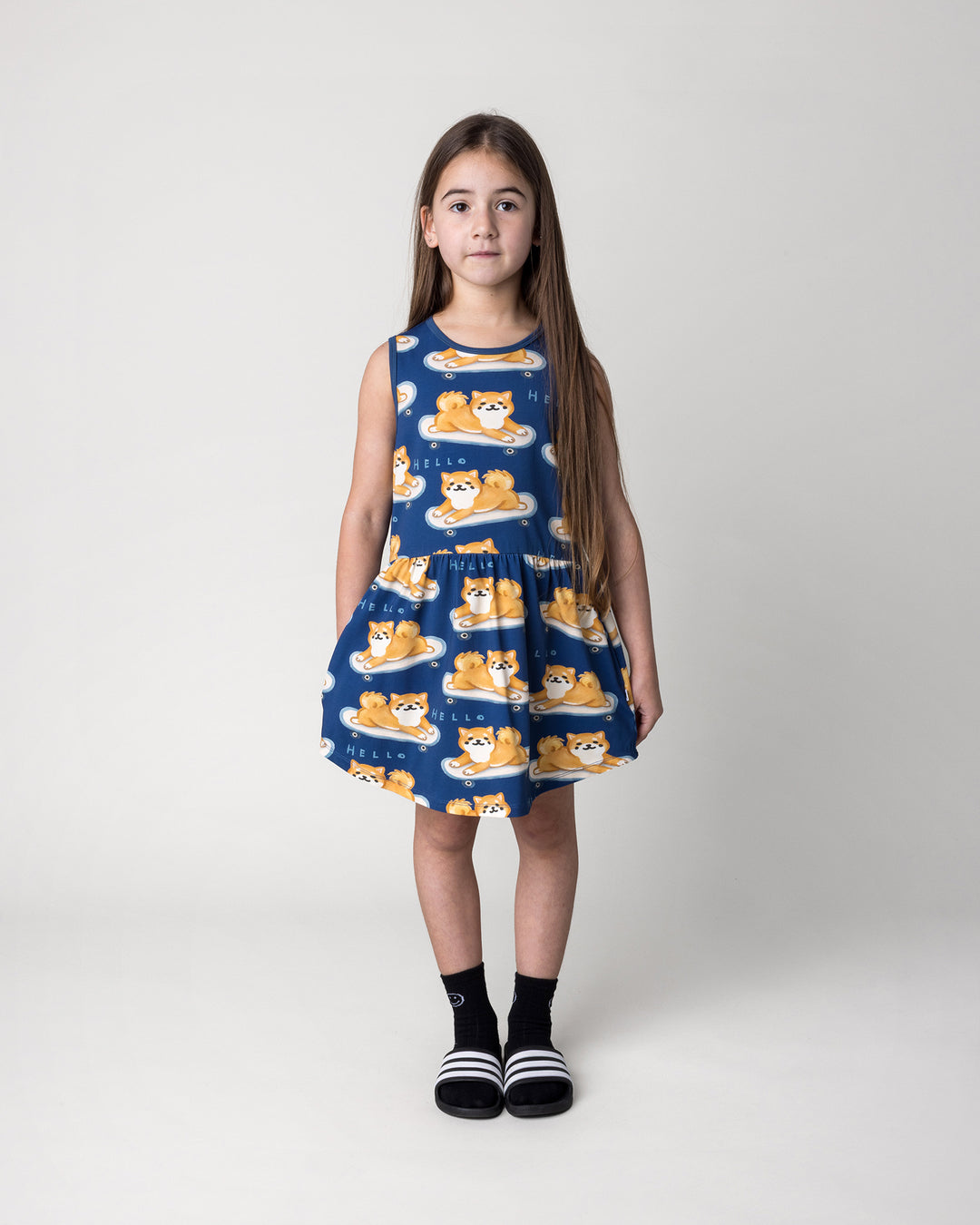 Kid wearing the Skate Puppy Dress in midnight, front view