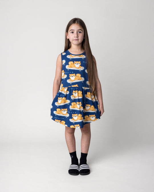 Kid wearing the Skate Puppy Dress in midnight, front view