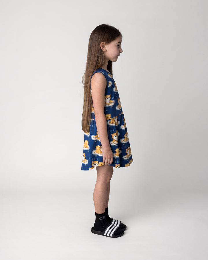 Kid wearing the Skate Puppy Dress in midnight, side view