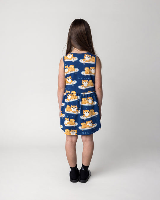Kid wearing the Skate Puppy Dress in midnight, back view