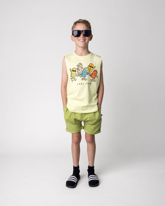 Kid wearing the Cool Crew Sleeveless Tee in light zest with the Roller Short in lime, front view
