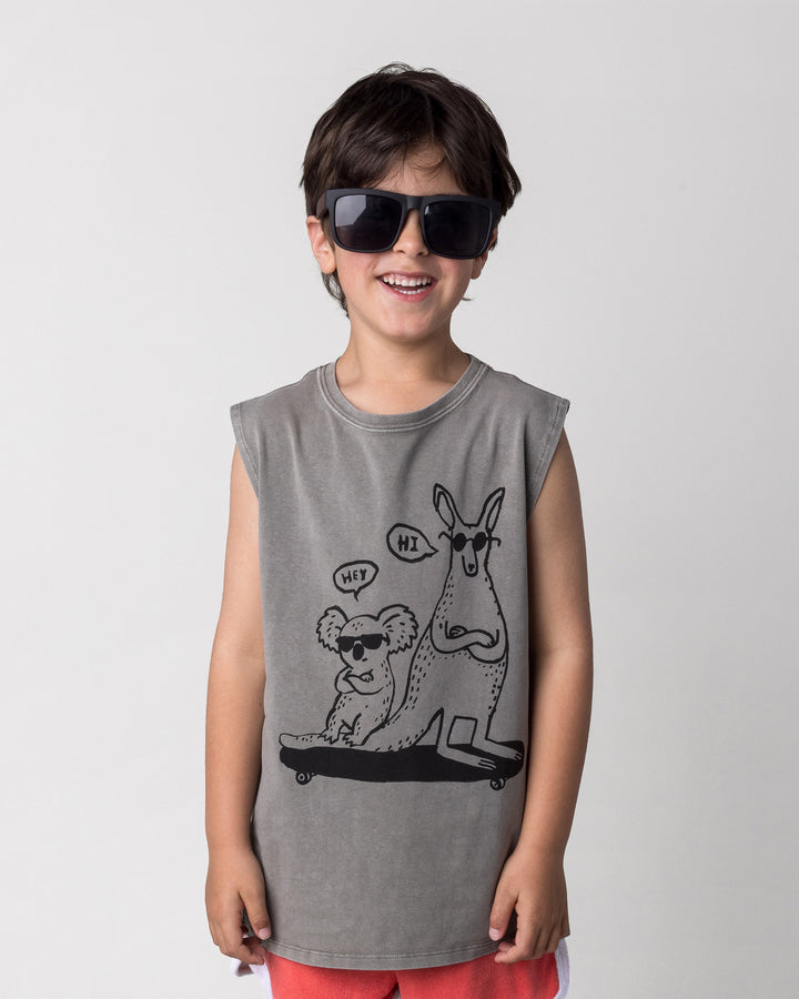 Close up of the Chill Mates Sleeveless Tee in grey wash on a kid, front view