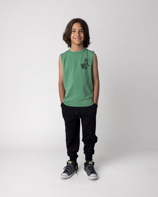 Kid wearing the Hi Pigeon Sleeveless Tee in turf wash with the Studio Trackies in black, front view