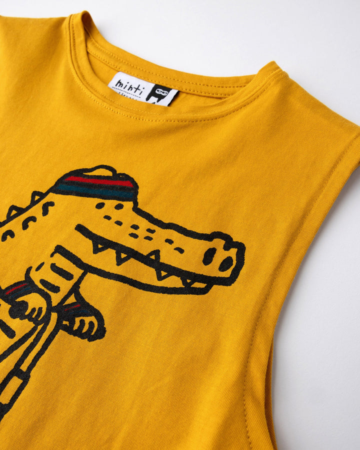 Close up detail of the Later Gator Sleeveless Tee in mustard
