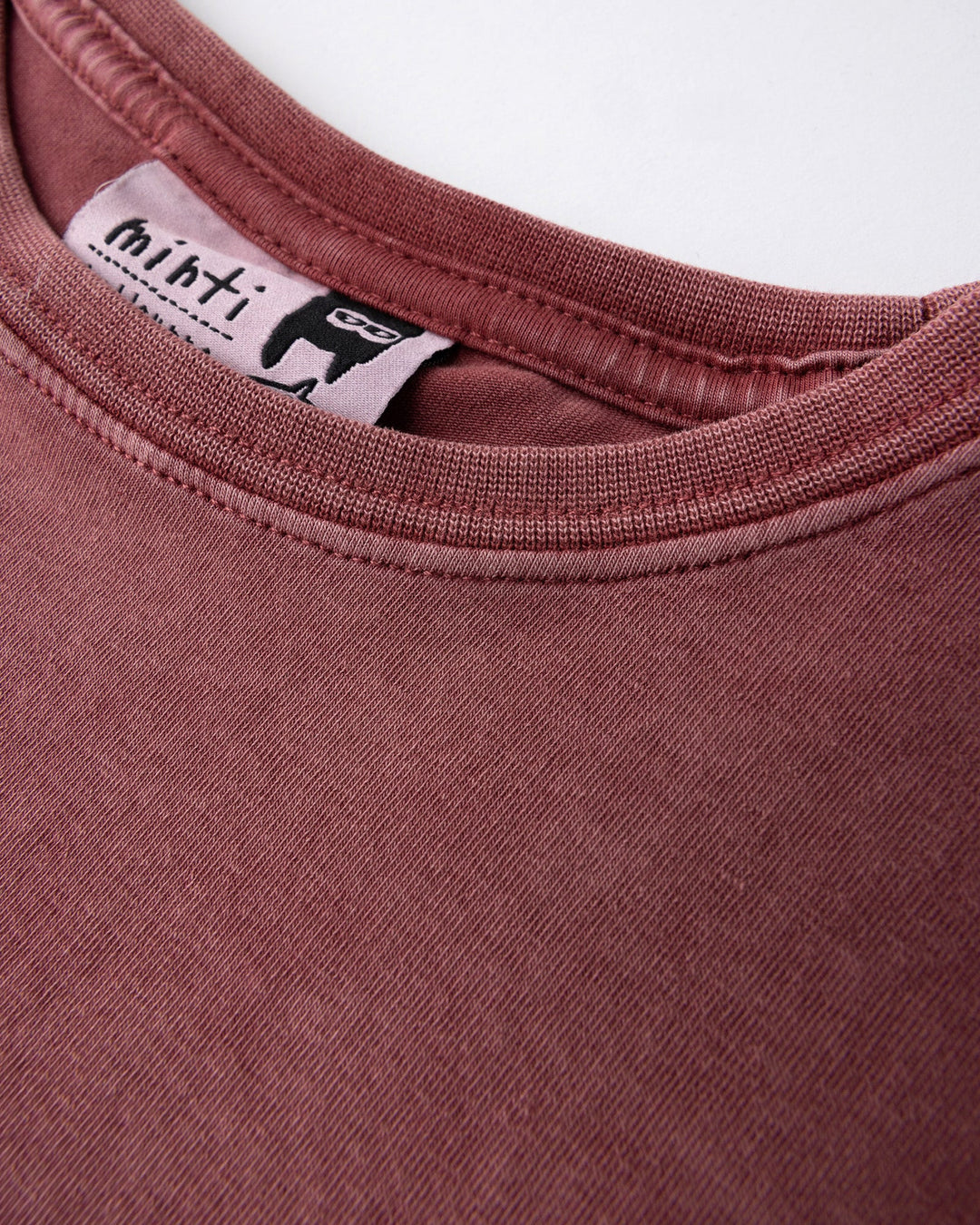 Close up detail of the Skate Ghost Sleeveless Tee in burnt red wash