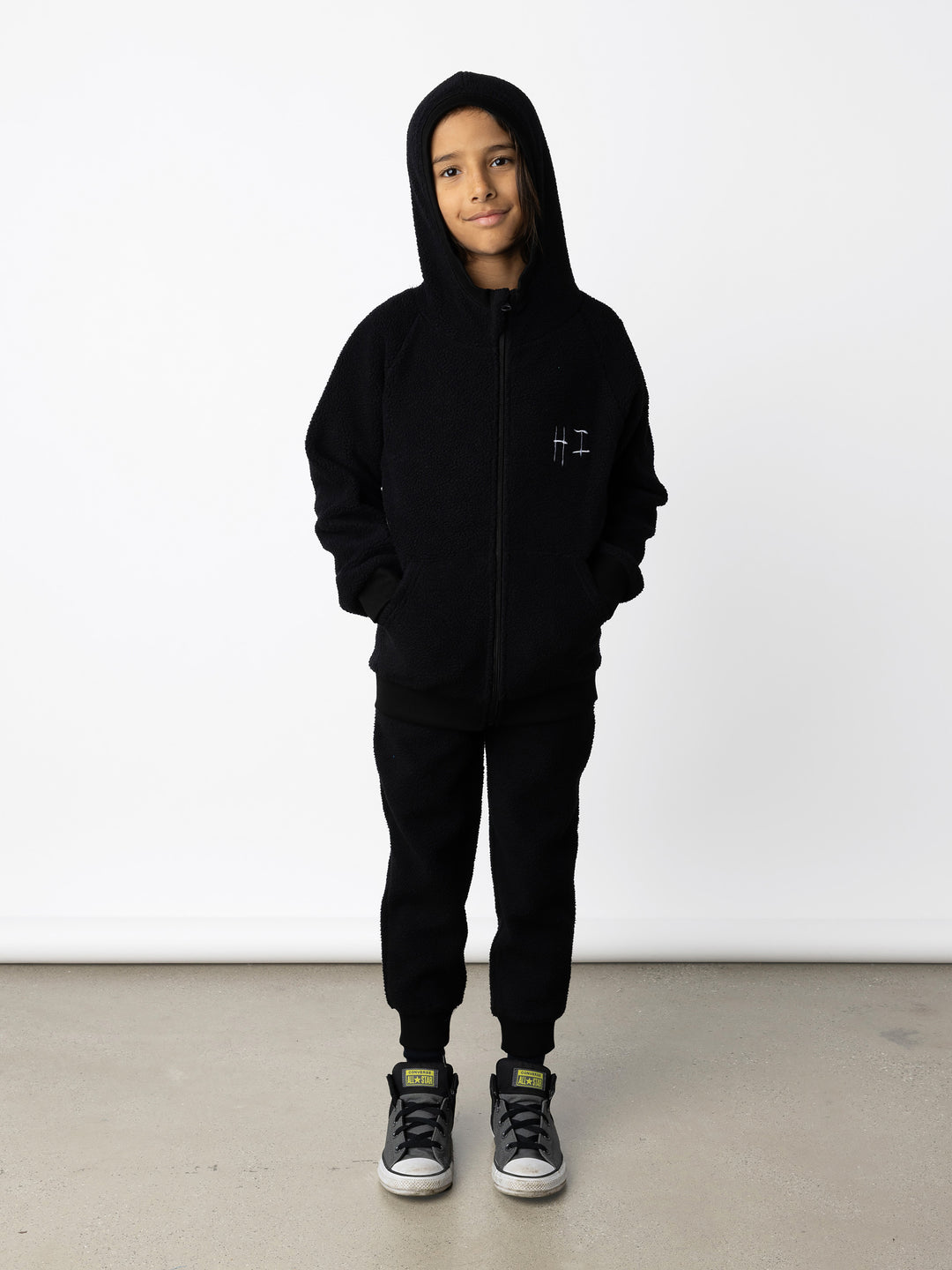 Minti kids clothing. Super cosy and soft Zip Up made in teddy with 2x2 rib cuffs and hem. Front pocket to keep hands warm. 70% Polyester // 30% Cotton.