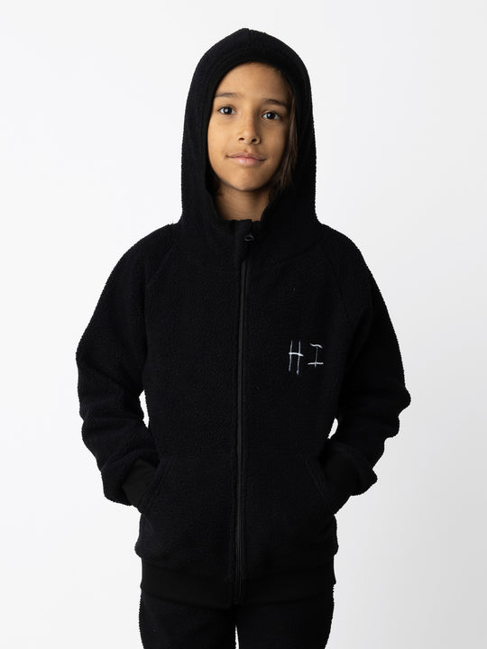 Minti kids clothing. Super cosy and soft Zip Up made in teddy with 2x2 rib cuffs and hem. Front pocket to keep hands warm. 70% Polyester // 30% Cotton.