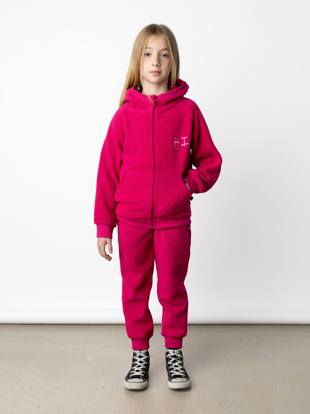 Minti kids clothing. Super cosy and soft Zip Up made in teddy with 2x2 rib cuffs and hem. Front pocket to keep hands warm. 70% Polyester // 30% Cotton.
