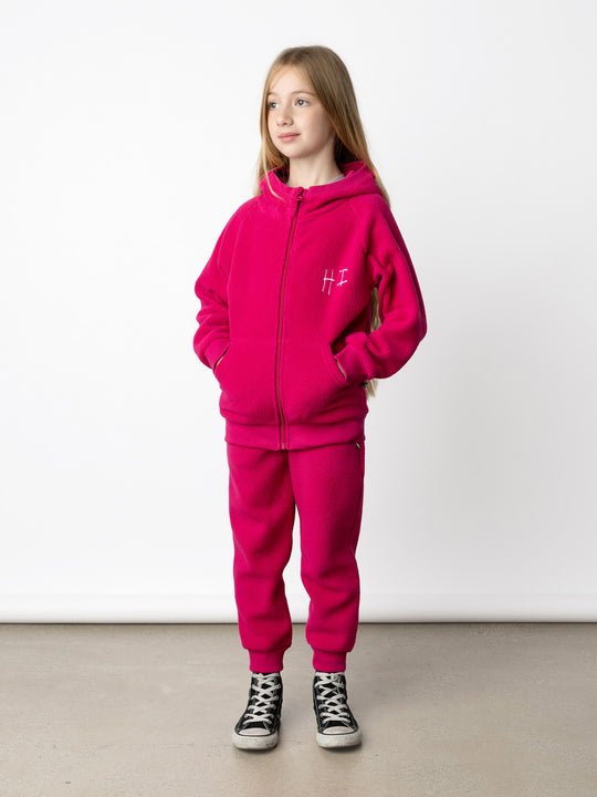 Minti kids clothing. Super cosy and soft Zip Up made in teddy with 2x2 rib cuffs and hem. Front pocket to keep hands warm. 70% Polyester // 30% Cotton.