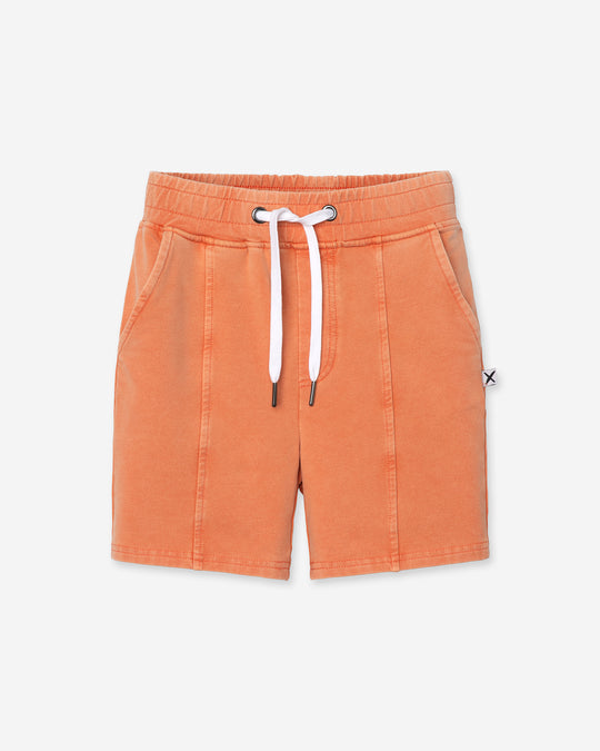 Blasted Panel Short in orange wash, boys shorts by Minti, flat lay