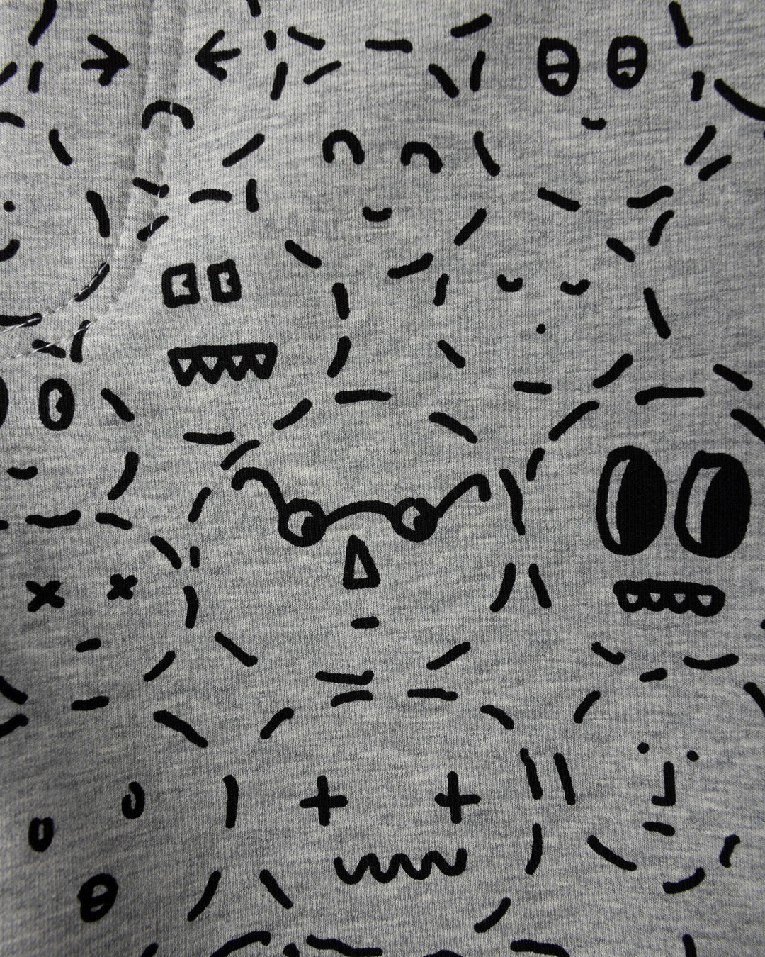 Close up of the Different Faces Short print in grey marle and black
