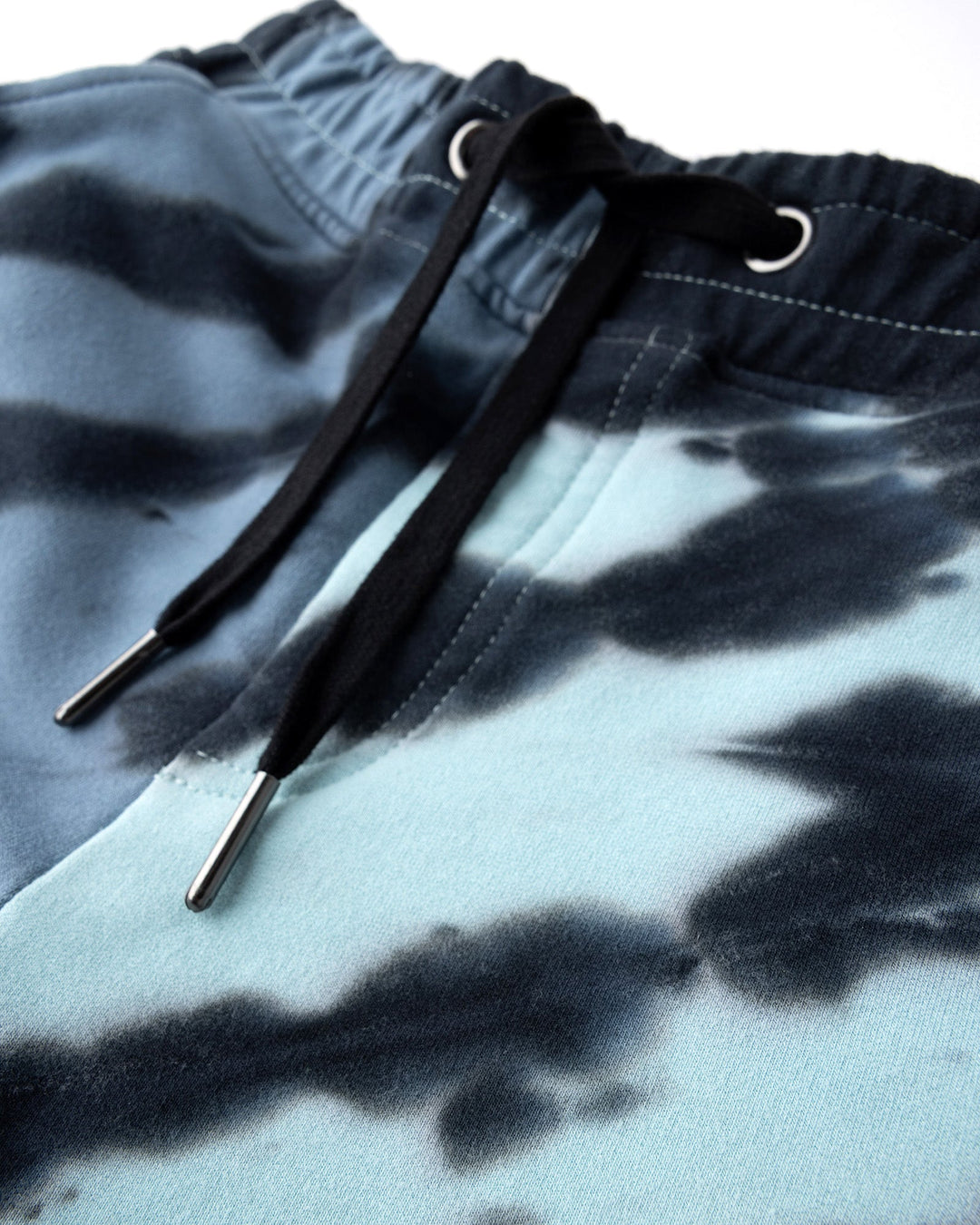 Close up detail of the Duo Tie Dye Short in blue and aqua