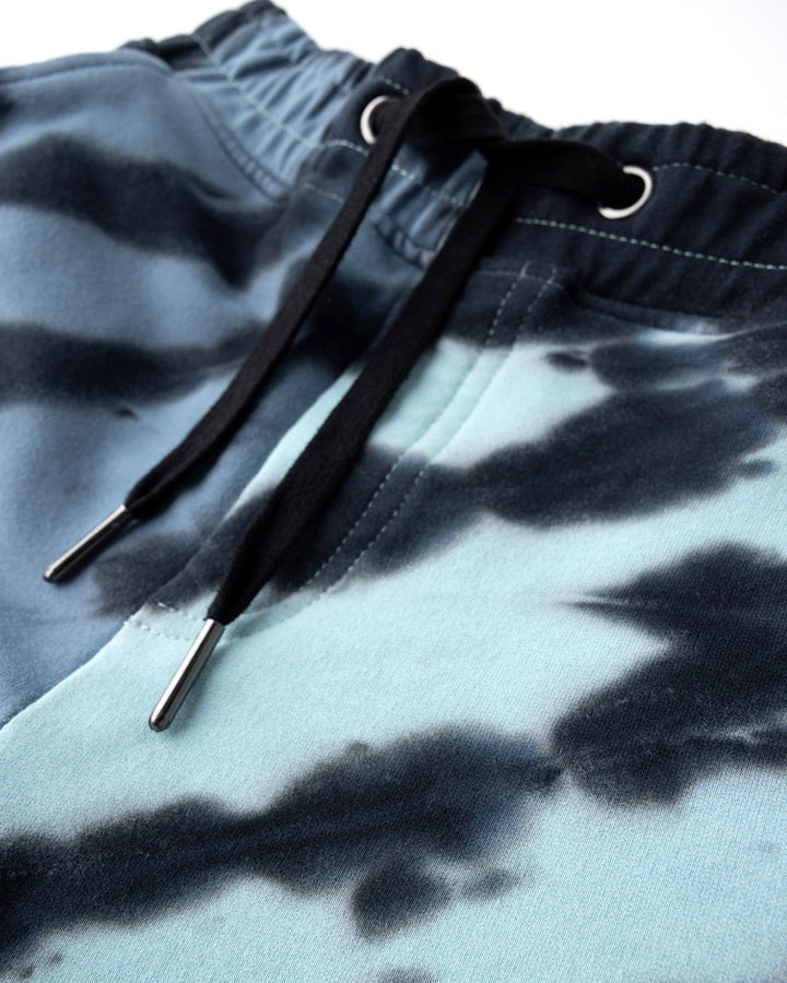 Close up detail of the Duo Tie Dye Short in blue and aqua