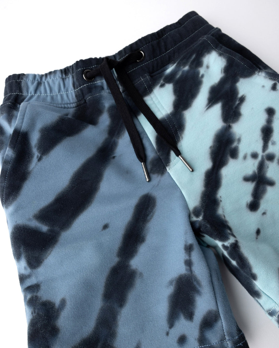 Close up of the Duo Tie Dye Short print in blue and aqua